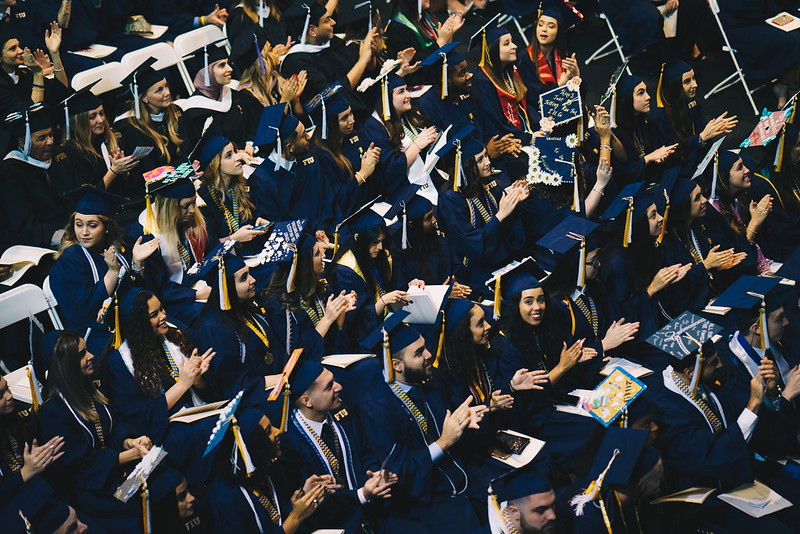 FIU students in their caps and gowns at commencement