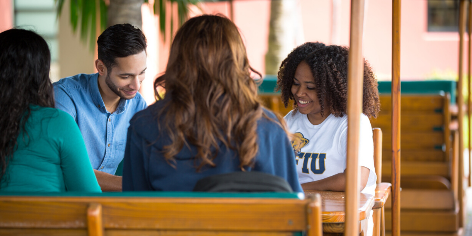 FIU Students on swinging table